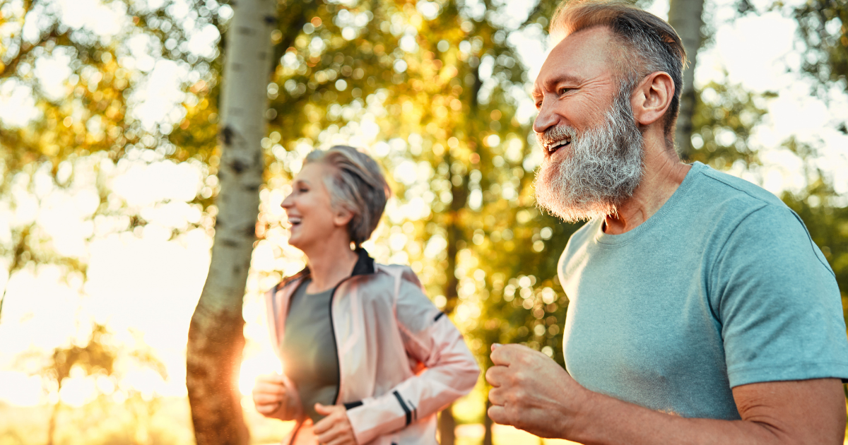 Active older couple jogging outdoors showing mobility, recovery, and longevity supported by stem cell therapy